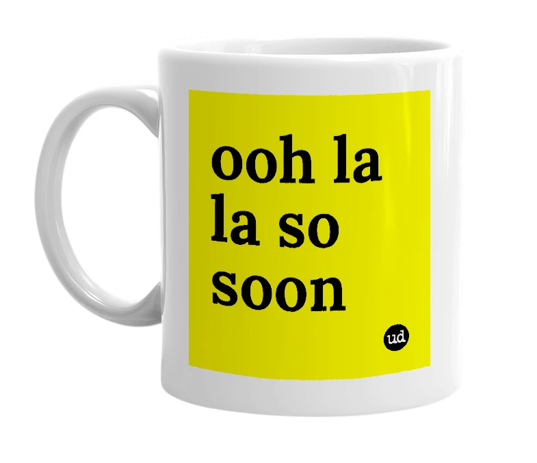 White mug with 'ooh la la so soon' in bold black letters