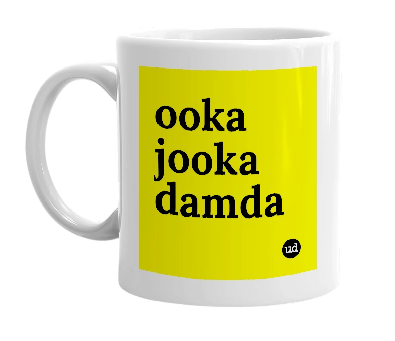 White mug with 'ooka jooka damda' in bold black letters