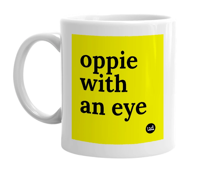 White mug with 'oppie with an eye' in bold black letters