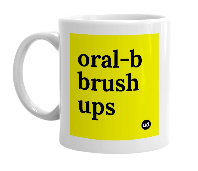 White mug with 'oral-b brush ups' in bold black letters