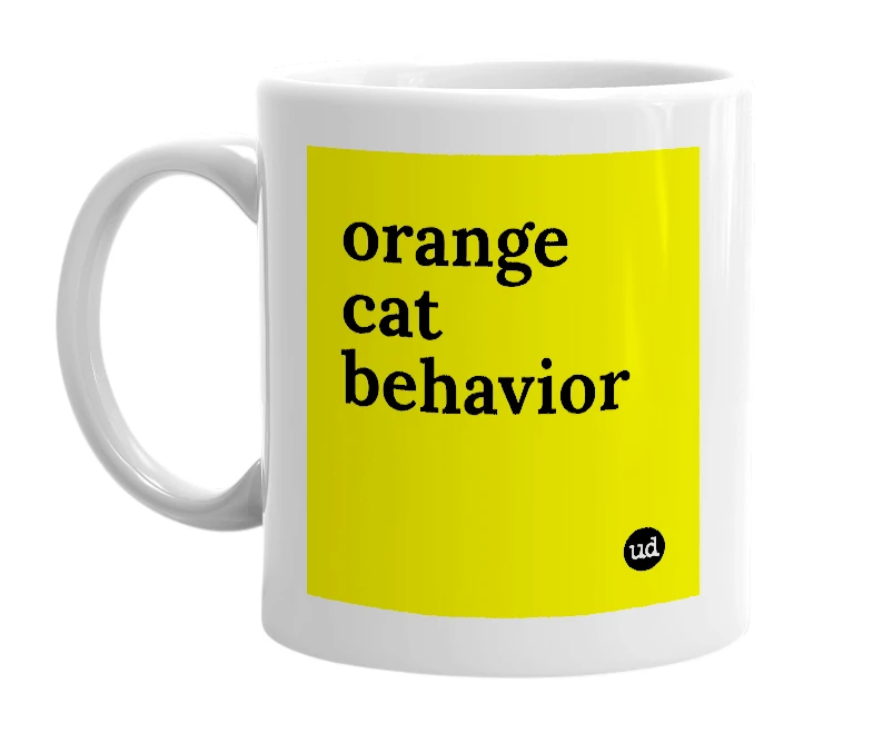 White mug with 'orange cat behavior' in bold black letters