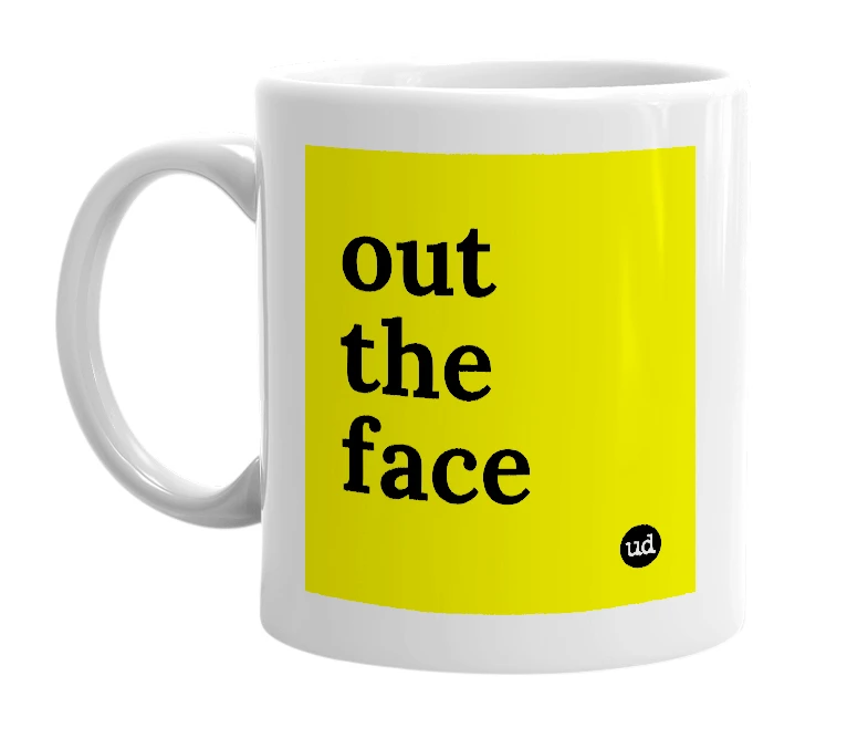 White mug with 'out the face' in bold black letters