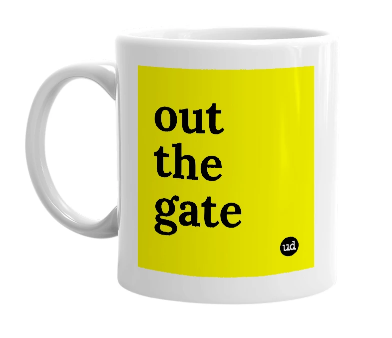 White mug with 'out the gate' in bold black letters