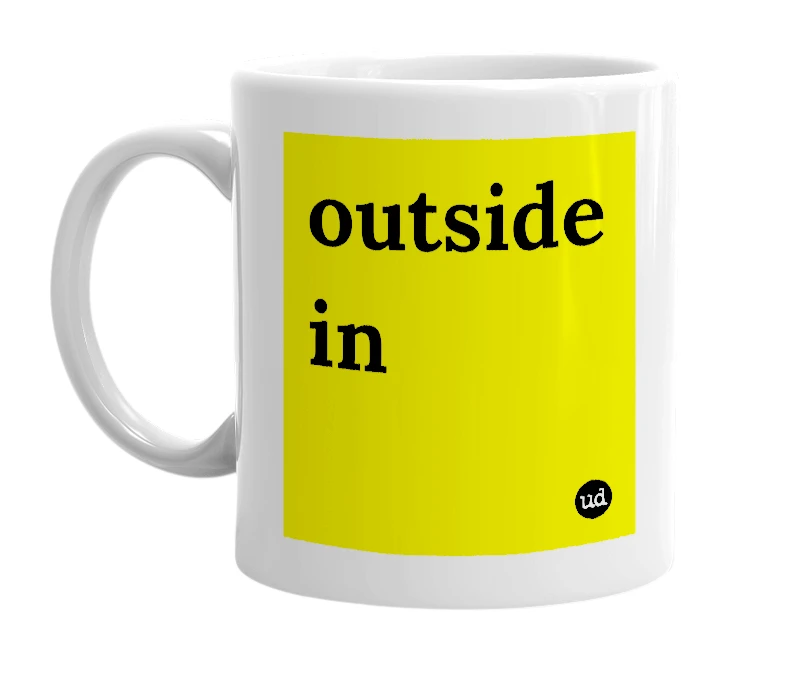 White mug with 'outside in' in bold black letters