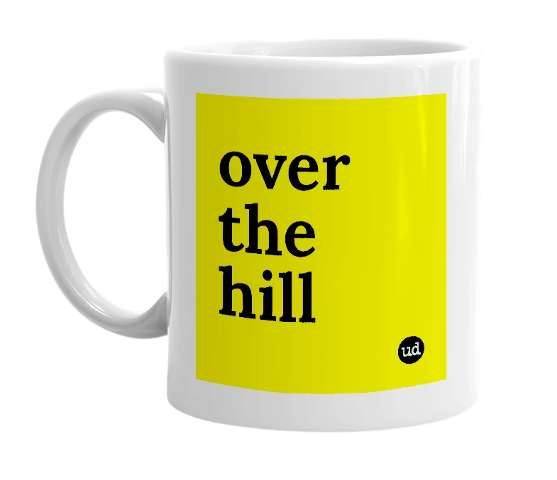 White mug with 'over the hill' in bold black letters