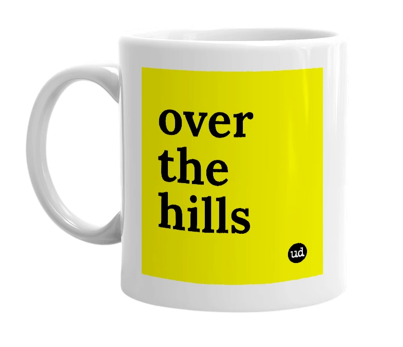White mug with 'over the hills' in bold black letters
