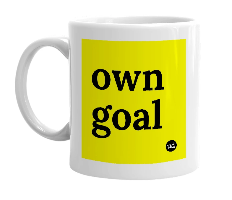 White mug with 'own goal' in bold black letters