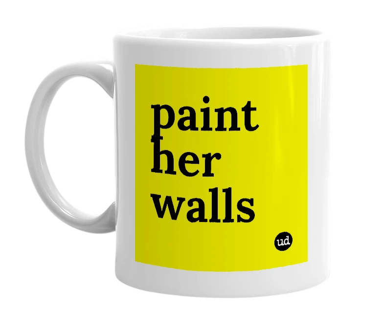 White mug with 'paint her walls' in bold black letters