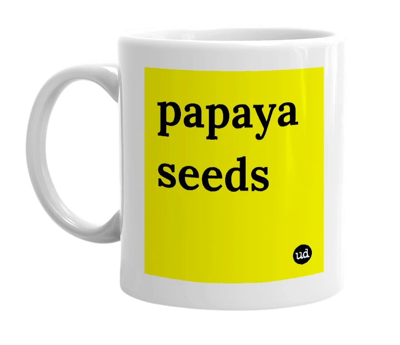 White mug with 'papaya seeds' in bold black letters