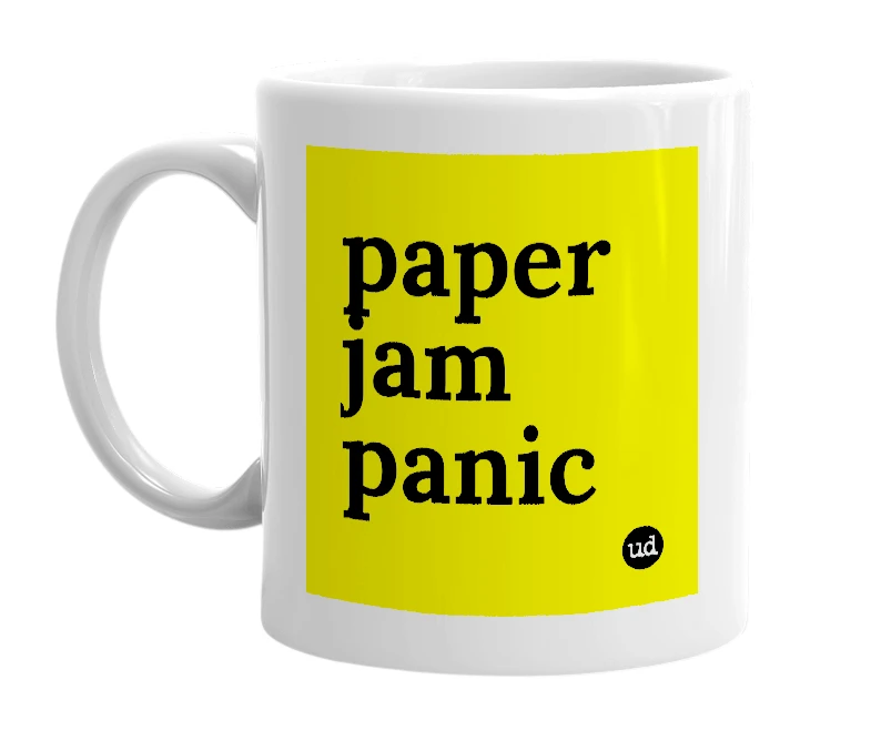 White mug with 'paper jam panic' in bold black letters