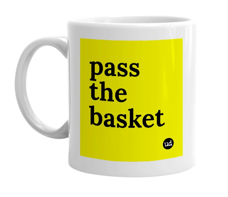 White mug with 'pass the basket' in bold black letters