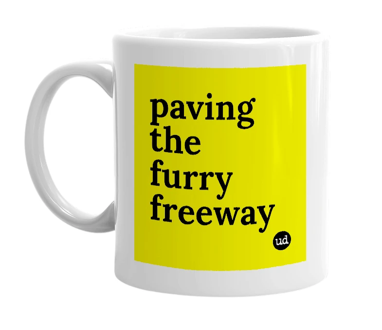 White mug with 'paving the furry freeway' in bold black letters