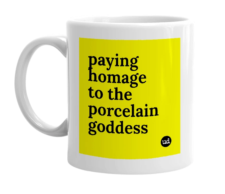 White mug with 'paying homage to the porcelain goddess' in bold black letters
