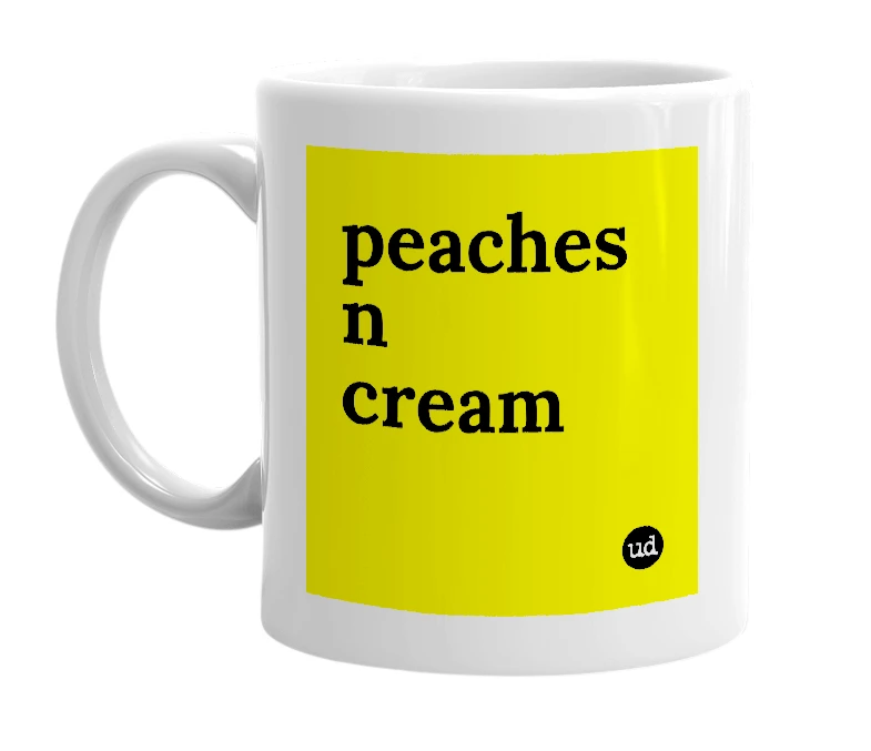 White mug with 'peaches n cream' in bold black letters