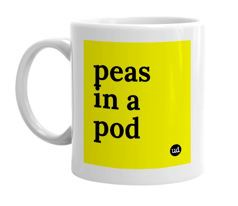 White mug with 'peas in a pod' in bold black letters