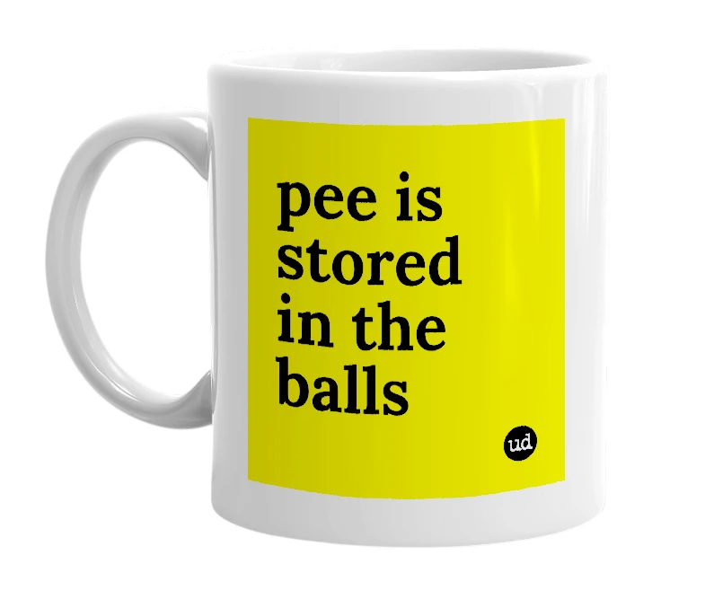 White mug with 'pee is stored in the balls' in bold black letters
