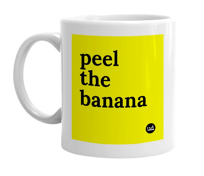 White mug with 'peel the banana' in bold black letters