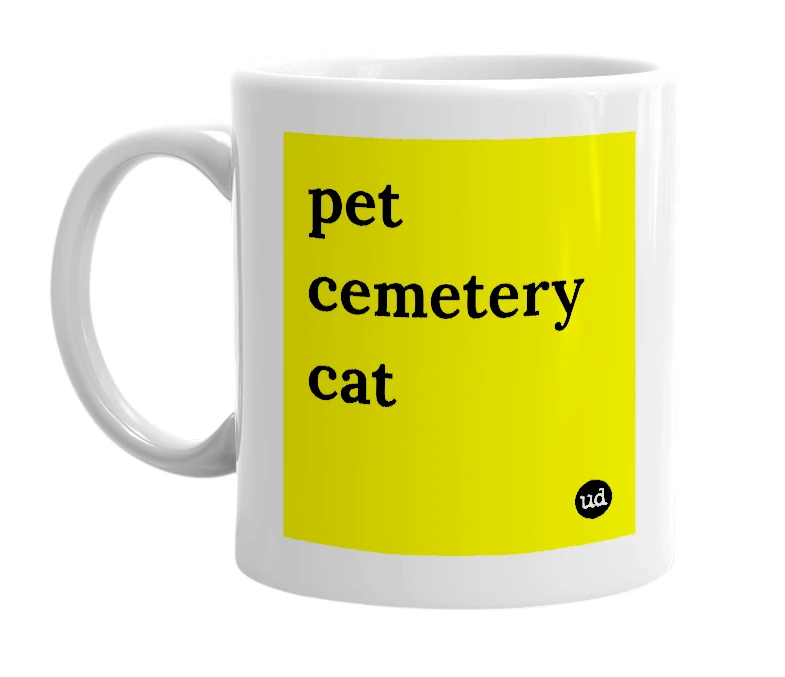 White mug with 'pet cemetery cat' in bold black letters