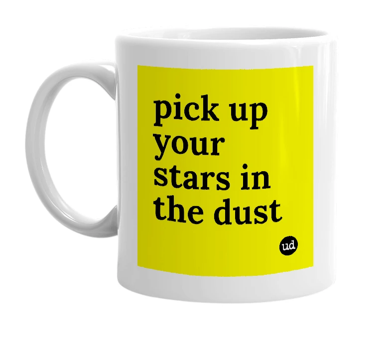 White mug with 'pick up your stars in the dust' in bold black letters