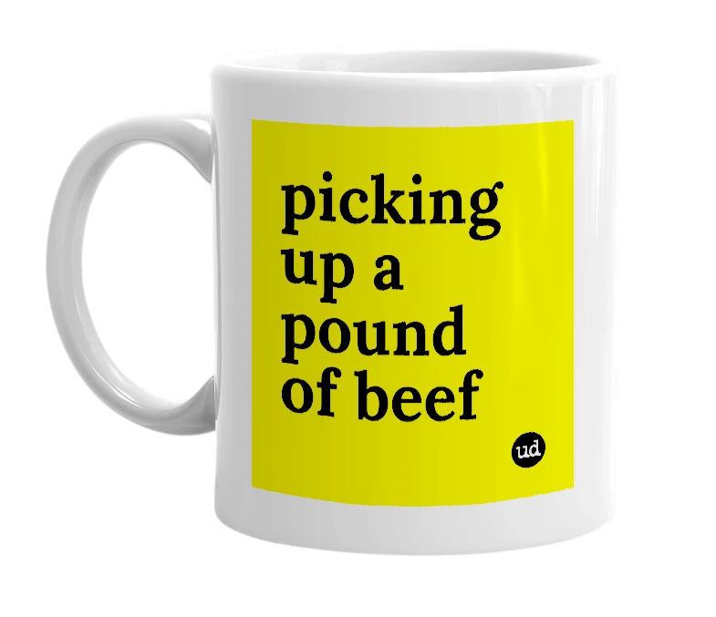 White mug with 'picking up a pound of beef' in bold black letters