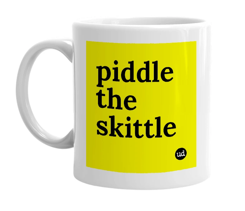 White mug with 'piddle the skittle' in bold black letters