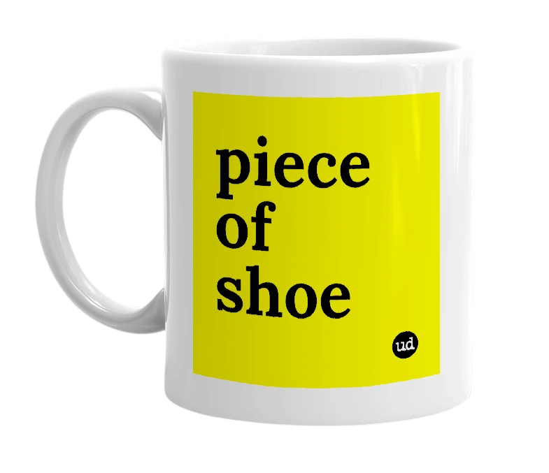 White mug with 'piece of shoe' in bold black letters