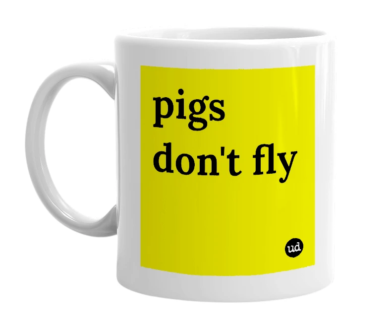 White mug with 'pigs don't fly' in bold black letters