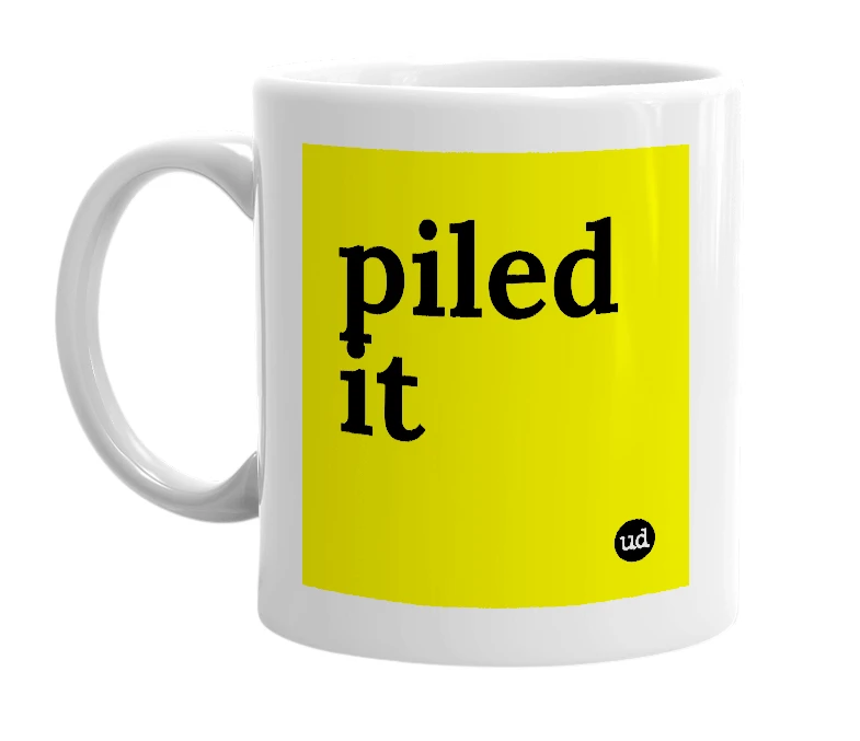 White mug with 'piled it' in bold black letters