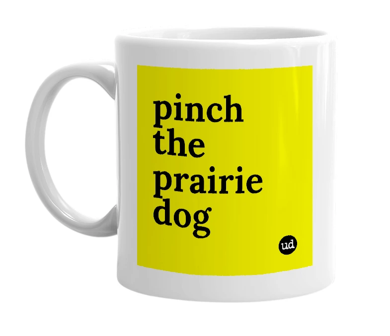 White mug with 'pinch the prairie dog' in bold black letters