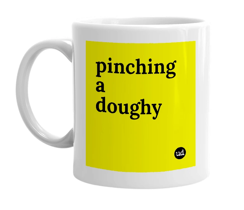 White mug with 'pinching a doughy' in bold black letters