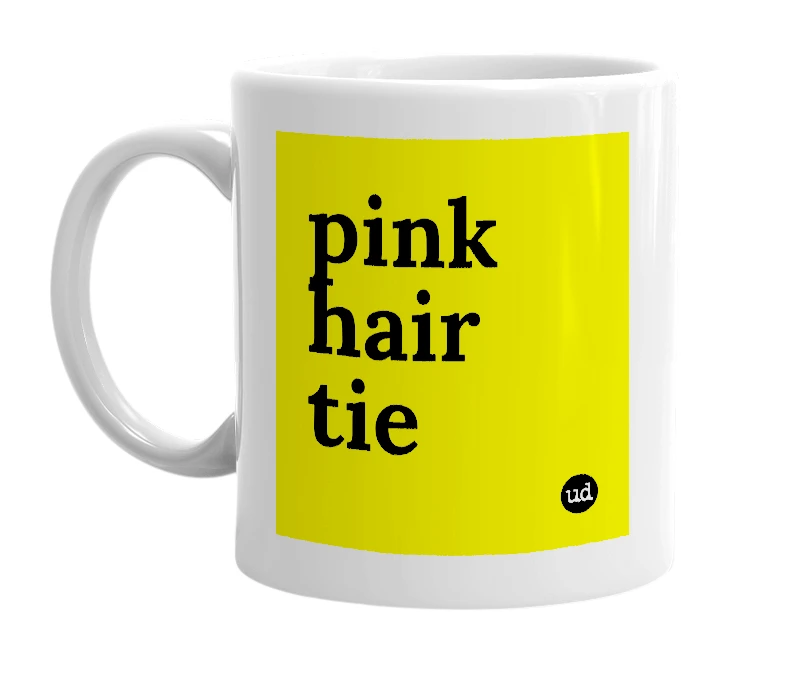 White mug with 'pink hair tie' in bold black letters