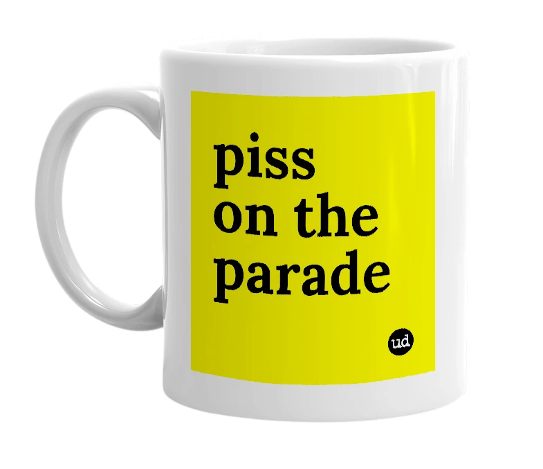 White mug with 'piss on the parade' in bold black letters