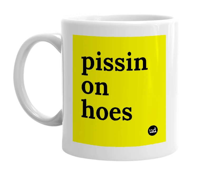 White mug with 'pissin on hoes' in bold black letters