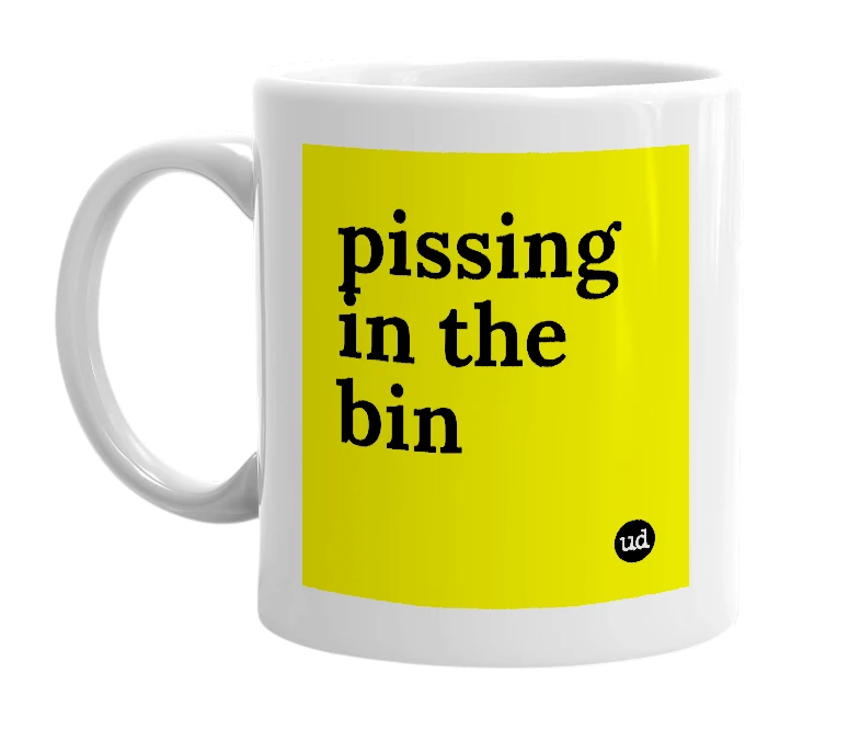 White mug with 'pissing in the bin' in bold black letters