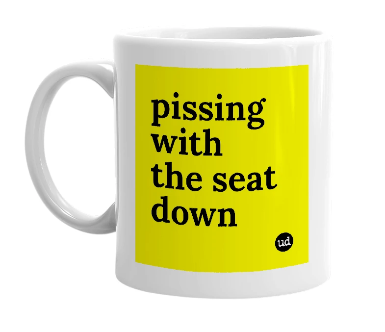 White mug with 'pissing with the seat down' in bold black letters