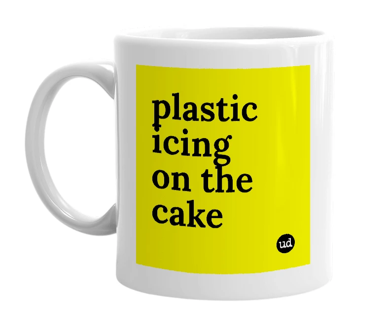 White mug with 'plastic icing on the cake' in bold black letters
