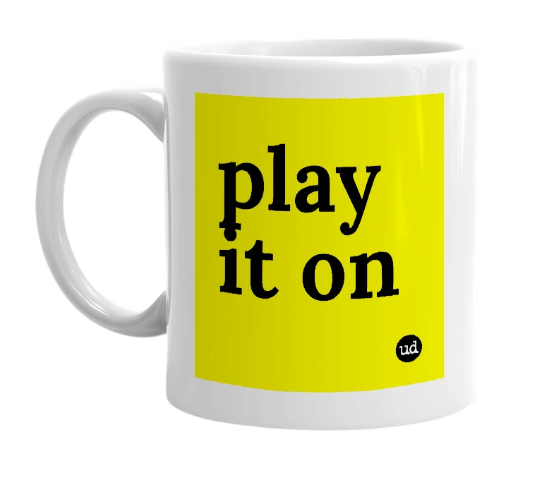 White mug with 'play it on' in bold black letters