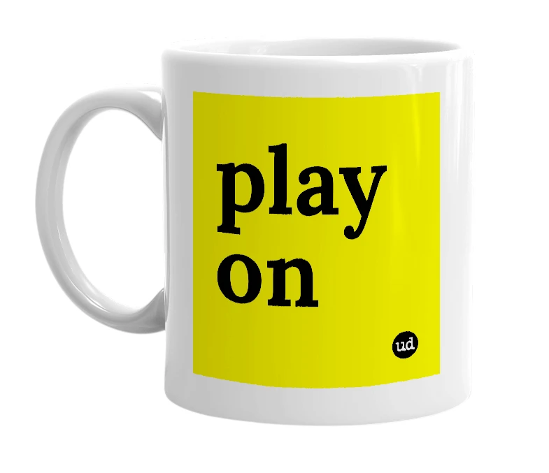 White mug with 'play on' in bold black letters