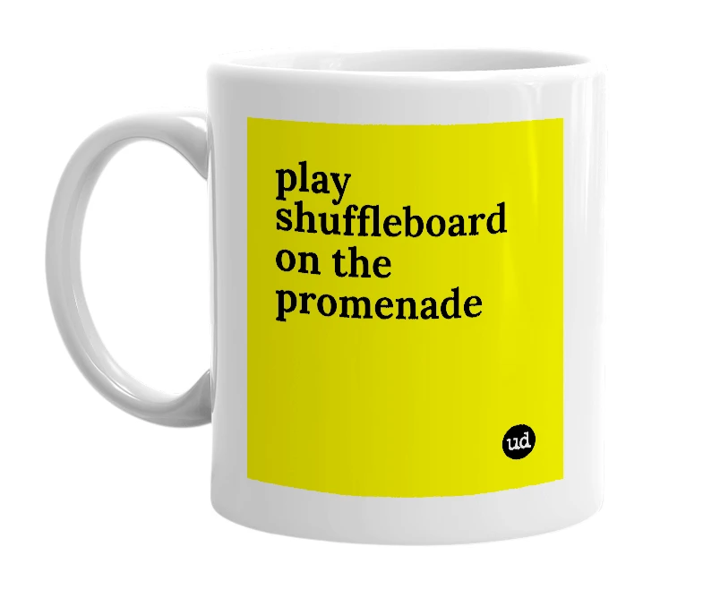 White mug with 'play shuffleboard on the promenade' in bold black letters