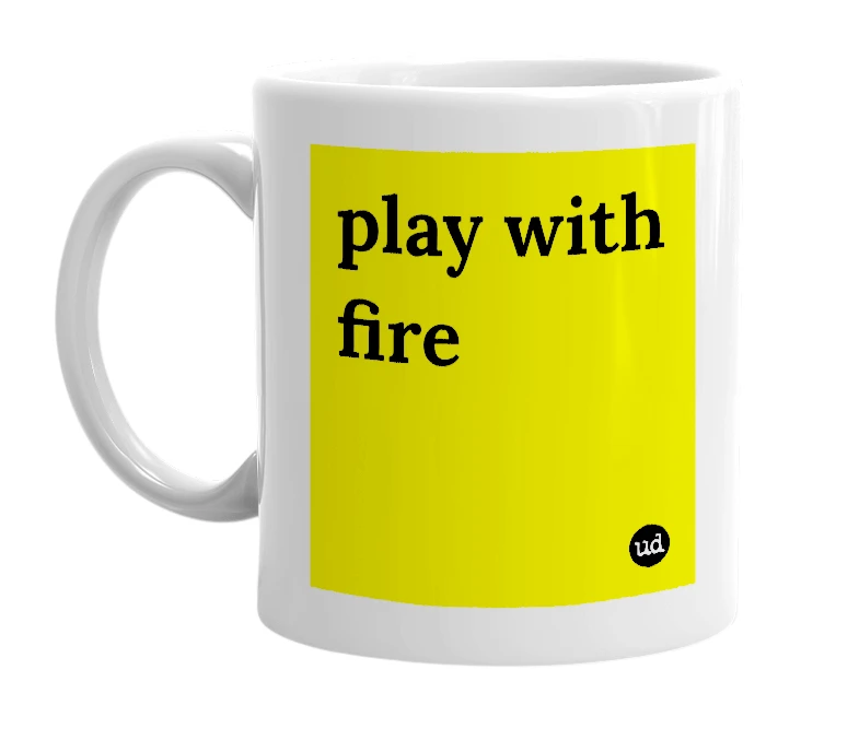 White mug with 'play with fire' in bold black letters