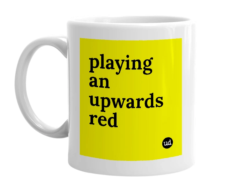 White mug with 'playing an upwards red' in bold black letters