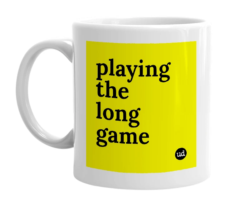 White mug with 'playing the long game' in bold black letters