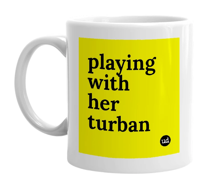 White mug with 'playing with her turban' in bold black letters