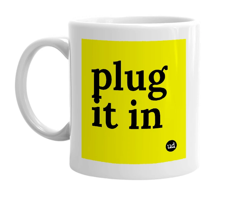 White mug with 'plug it in' in bold black letters