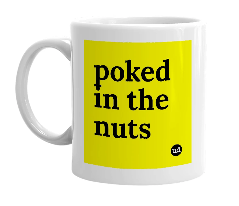 White mug with 'poked in the nuts' in bold black letters