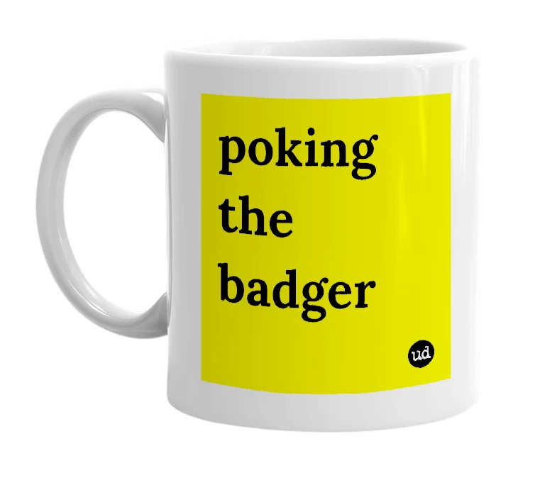 White mug with 'poking the badger' in bold black letters