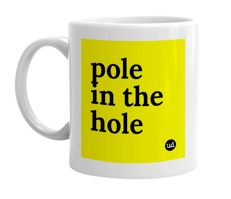 White mug with 'pole in the hole' in bold black letters