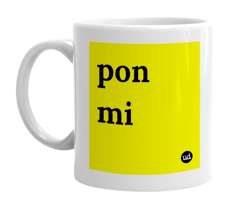 White mug with 'pon mi' in bold black letters