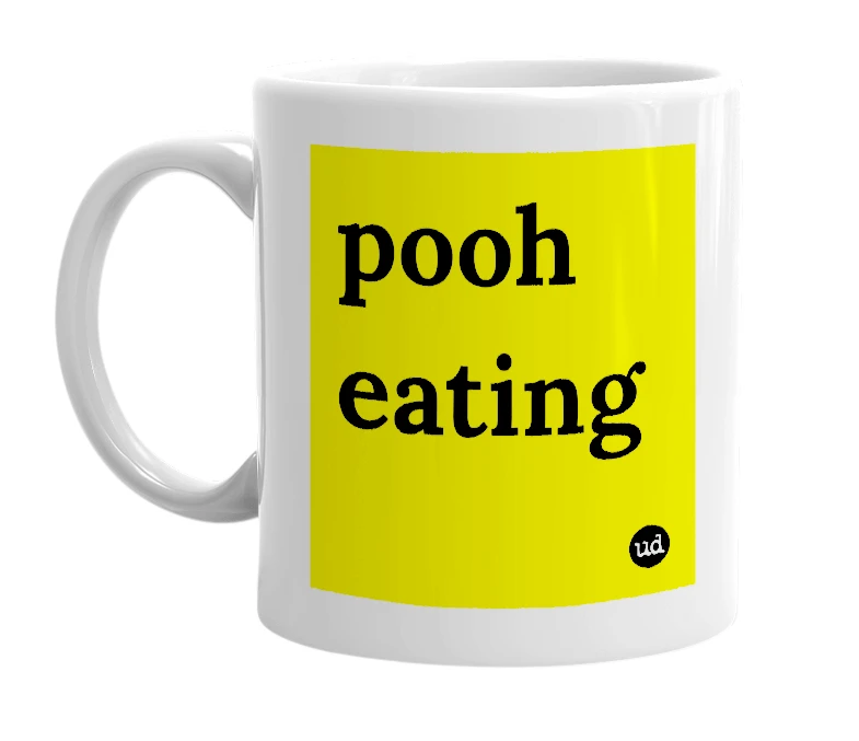 White mug with 'pooh eating' in bold black letters