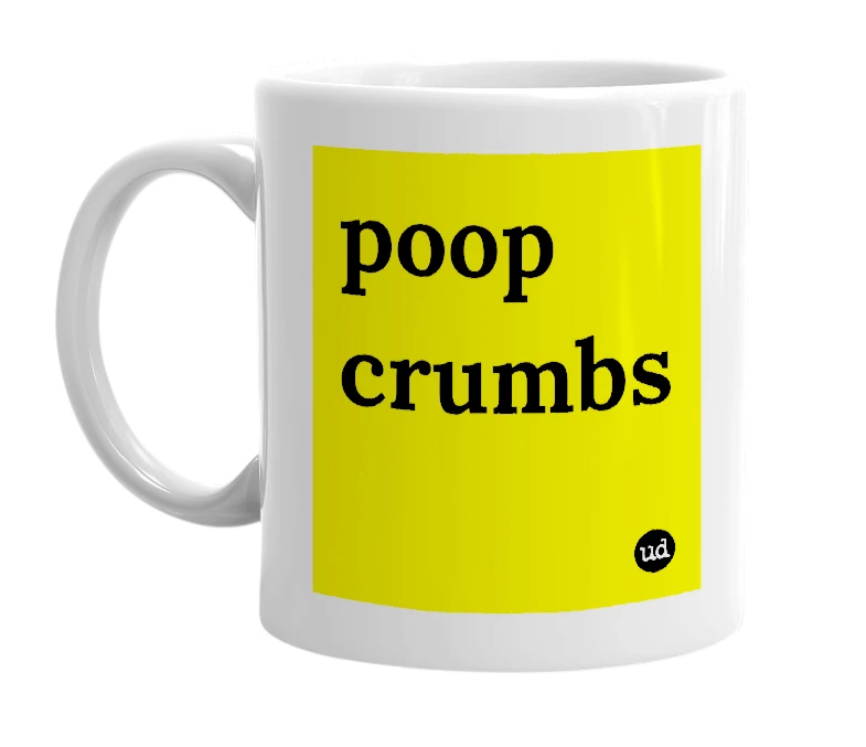 White mug with 'poop crumbs' in bold black letters